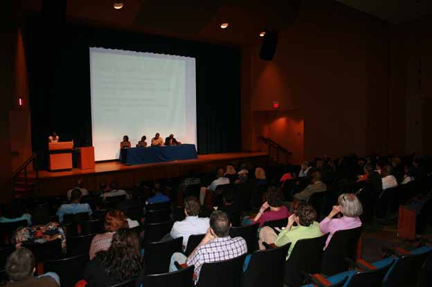 A group of people in a auditorium