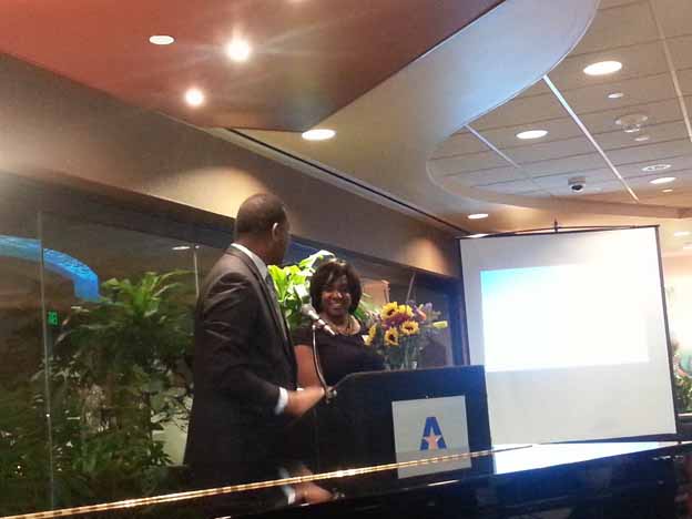 Two people standing at a podium