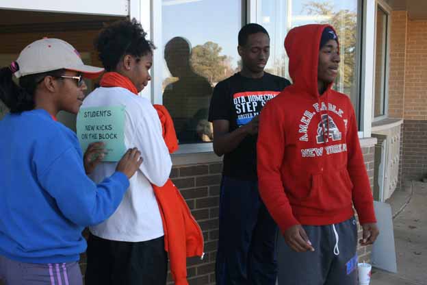 A group of people standing outside a building