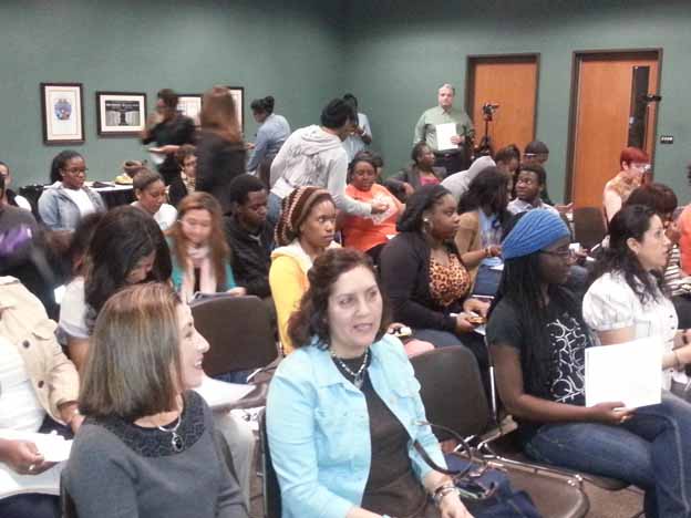 A group of people sitting in a room