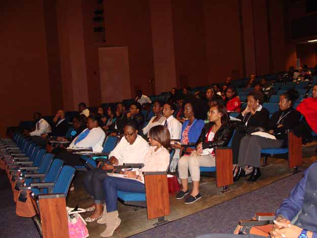 A group of people sitting in a lecture hall