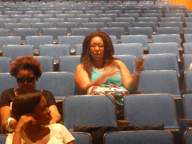 A group of women sitting in a auditorium