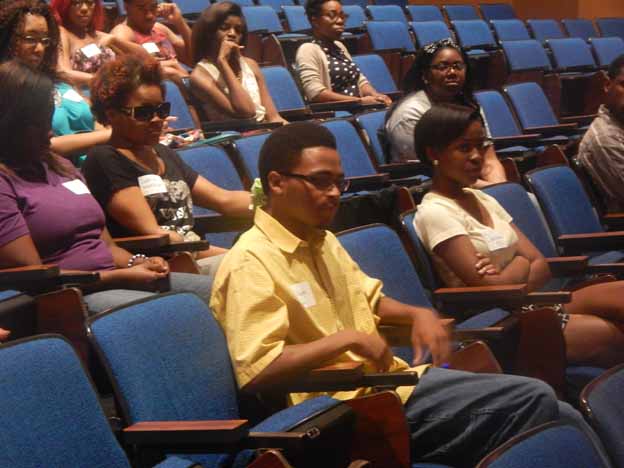 A group of people sitting in a lecture hall