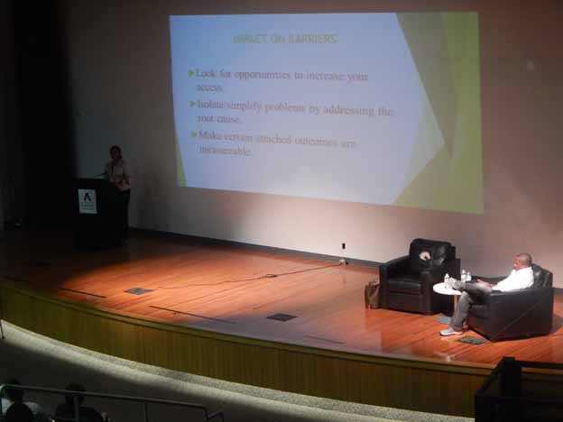 A person presenting on a stage