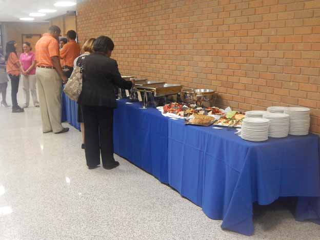 People standing in line at a buffet