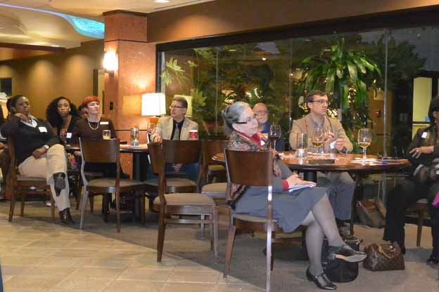 A group of people sitting at tables