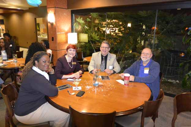 A group of people sitting around a table