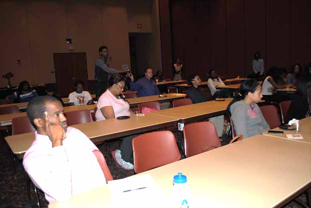 A group of people sitting in a lecture hall