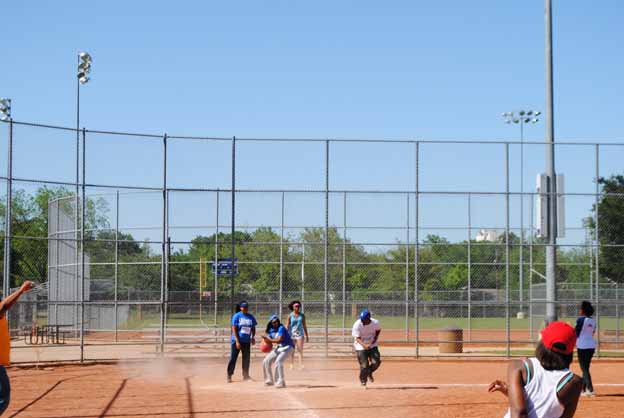 A group of people playing baseball