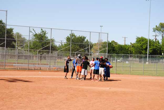 A group of people on a dirt field
