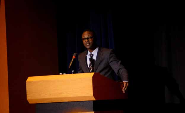 A person standing at a podium