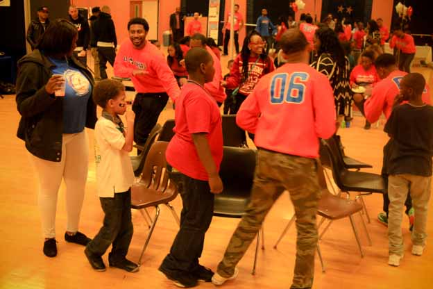 A group of people in a room playing