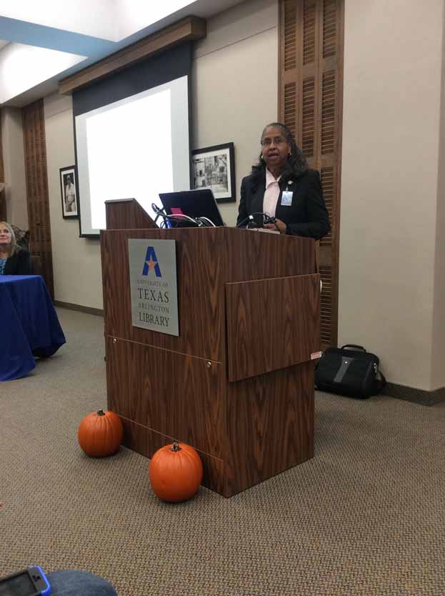 A person standing at a podium