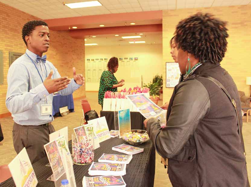 A person explaining something to other at a stall