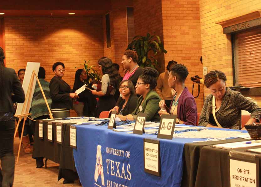 A group of people near the registration desk