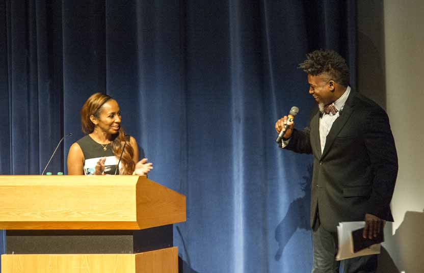 Two people at a podium in the conference
