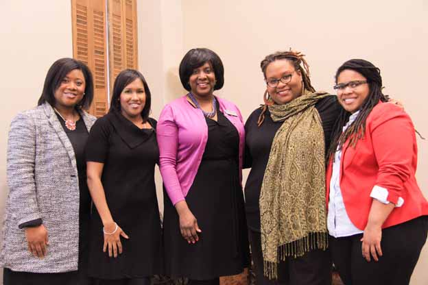 A group of women posing for a photo