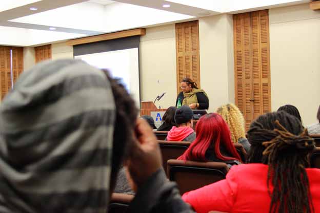 A person giving a presentation in a lecture hall