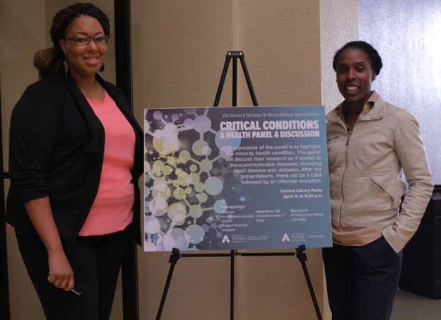 Presenters standing next to the poster and posing for a photo