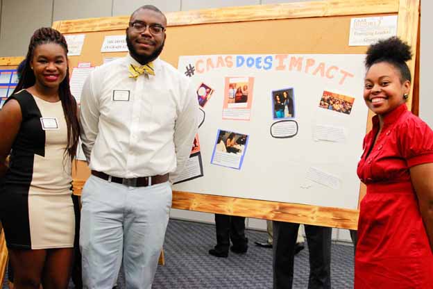 A person standing next to a presentation board