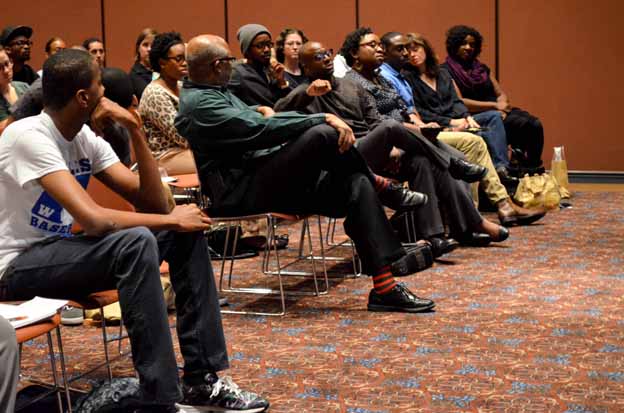 A group of people sitting in chairs