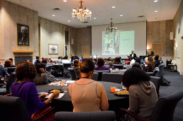 A group of people sitting at tables in a room