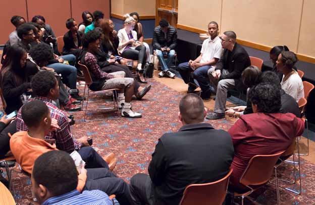A group of people sitting in a circle
