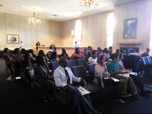 A group of people sitting in a room