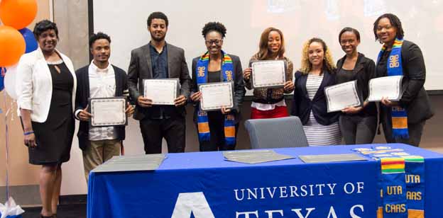 A group of people holding certificates
