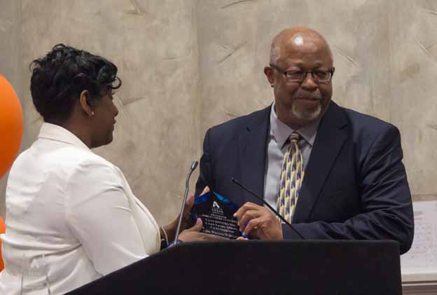 A person receiving an award