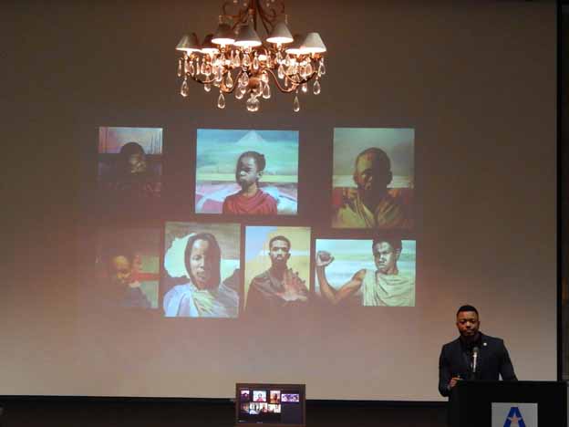 A person standing in front of a projector screen