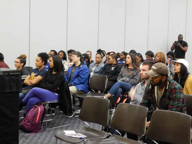 A group of people sitting in a room