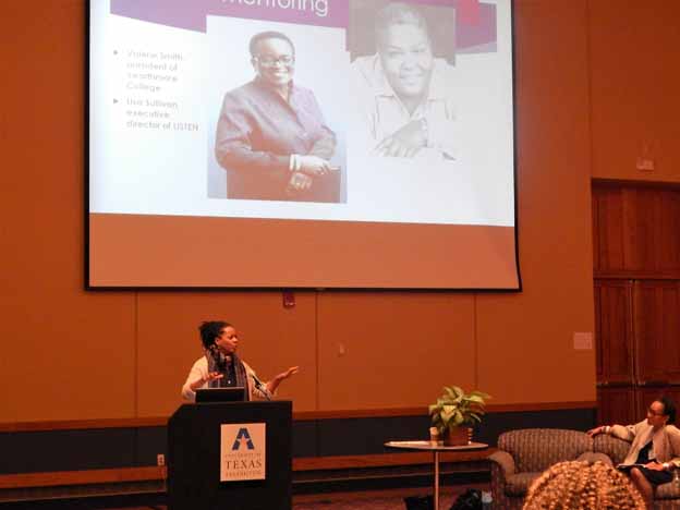 A person standing at a podium giving a presentation