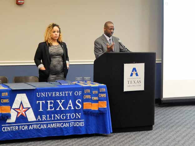 Two people standing at a podium