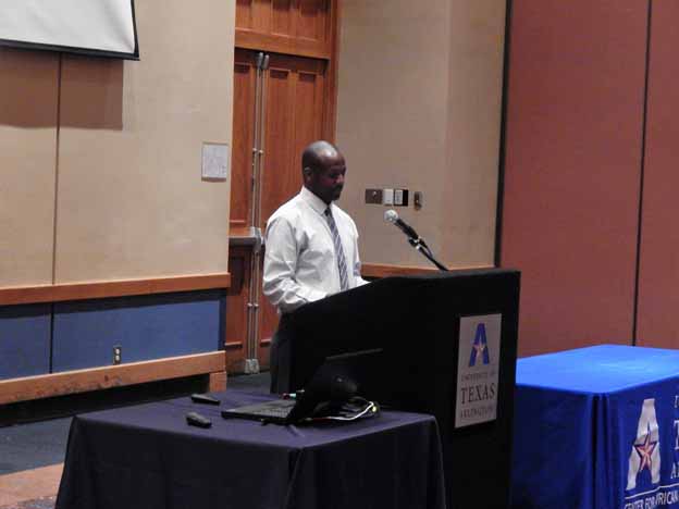 A person standing at a podium