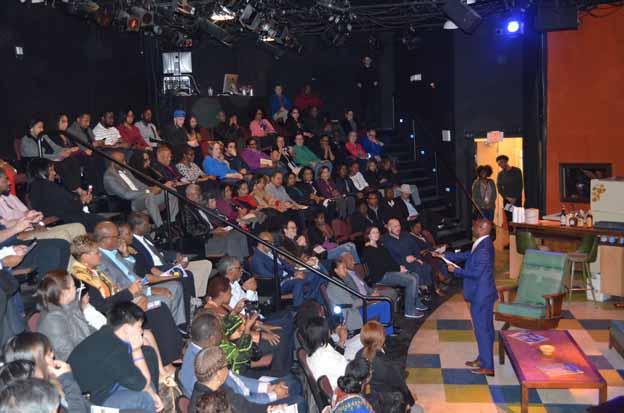 A person standing in front of a crowd of people